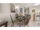 Charming dining space with glass table, seating, and access to the bar and kitchen at 2346 Silver Palm Dr, Kissimmee, FL 34747