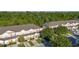 Charming townhomes featuring manicured lawns, driveways, and colorful front doors at 2346 Silver Palm Dr, Kissimmee, FL 34747
