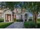 Charming townhome showcasing lush landscaping and a welcoming entrance at 2346 Silver Palm Dr, Kissimmee, FL 34747