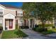 Inviting townhome showcasing a well-manicured lawn and walkway leading to the front door at 2346 Silver Palm Dr, Kissimmee, FL 34747
