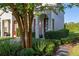 Charming townhome showcasing lush landscaping, stepping stones, and a welcoming entrance at 2346 Silver Palm Dr, Kissimmee, FL 34747