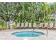 Relaxing hot tub surrounded by lush tropical landscaping and comfortable lounge chairs at 2346 Silver Palm Dr, Kissimmee, FL 34747