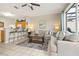 Cozy living room next to kitchen bar with comfortable seating and natural light at 2346 Silver Palm Dr, Kissimmee, FL 34747