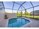 Enjoy the privacy of your screened-in pool in this beautifully landscaped backyard at 2346 Silver Palm Dr, Kissimmee, FL 34747