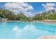 Spacious community pool perfect for relaxation and recreation, surrounded by comfortable lounge chairs at 2346 Silver Palm Dr, Kissimmee, FL 34747