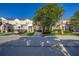 Street view of townhomes with manicured lawns, driveways, and street parking available at 2346 Silver Palm Dr, Kissimmee, FL 34747