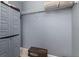 Walk-in closet features ample storage with shelving and a gray storage unit at 2346 Silver Palm Dr, Kissimmee, FL 34747