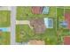 Overhead view of a home, showing landscaping, private pool, and driveway at 2445 Ravendale Ct, Kissimmee, FL 34758