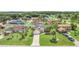 Overhead view of the property, highlighting the well-kept lawn and proximity to other homes at 2445 Ravendale Ct, Kissimmee, FL 34758