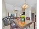 Open concept space featuring a dining area flowing into the living room and kitchen at 2445 Ravendale Ct, Kissimmee, FL 34758