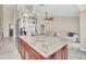 Spacious kitchen with large island, granite counters, stainless appliances, and open living area at 2445 Ravendale Ct, Kissimmee, FL 34758