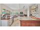 Stylish kitchen featuring granite countertops, stainless steel appliances, and lots of natural light at 2445 Ravendale Ct, Kissimmee, FL 34758