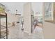 Spacious open-concept living area leading to kitchen with stainless steel appliances and back patio at 2445 Ravendale Ct, Kissimmee, FL 34758