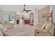 Open concept living area with vaulted ceiling, ceiling fan, and a view of the kitchen and pool at 2445 Ravendale Ct, Kissimmee, FL 34758