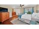 Comfortable main bedroom with wood floors, ceiling fan, and view to pool at 2445 Ravendale Ct, Kissimmee, FL 34758