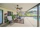Spacious covered patio featuring an outdoor dining area, ceiling fans, and views of the pool and backyard at 2445 Ravendale Ct, Kissimmee, FL 34758