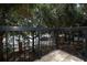 Balcony offers outdoor space with iron railings overlooking lush greenery, providing a serene escape at 2493 Lancien Ct # 5, Orlando, FL 32826