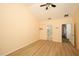 Bright, airy bedroom features ceiling fan and laminate floors with easy access to bathroom at 2493 Lancien Ct # 5, Orlando, FL 32826