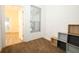 Cozy bedroom with neutral carpet, window with blinds, and cube storage at 2493 Lancien Ct # 5, Orlando, FL 32826