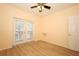 Bright room with laminate flooring, ceiling fan, and French door at 2493 Lancien Ct # 5, Orlando, FL 32826