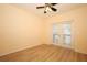 Bright room with laminate flooring, ceiling fan, and French door at 2493 Lancien Ct # 5, Orlando, FL 32826