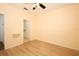 Bright room with laminate flooring, ceiling fan, and ensuite bathroom at 2493 Lancien Ct # 5, Orlando, FL 32826