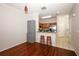 Open-concept kitchen area with stainless steel appliances, granite countertops, and hardwood flooring at 2493 Lancien Ct # 5, Orlando, FL 32826