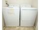 The laundry room features a white washer and dryer set with easy access for residents at 2493 Lancien Ct # 5, Orlando, FL 32826