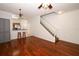 Inviting living space with hardwood floors, an open layout, and a staircase leading to the upper floor at 2493 Lancien Ct # 5, Orlando, FL 32826