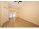 Spacious living room with vaulted ceiling, laminate flooring, and French doors to enjoy natural light at 2493 Lancien Ct # 5, Orlando, FL 32826