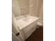 Bathroom featuring a white vanity with stone countertop, modern faucet, and wood-style floors at 2723 Talladega Dr, Orlando, FL 32826