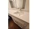 Bathroom vanity with white cabinetry, neutral countertop, and modern faucet fixtures at 2723 Talladega Dr, Orlando, FL 32826