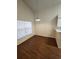 Dining area featuring wood flooring, a modern pendant light, and neutral walls at 2723 Talladega Dr, Orlando, FL 32826