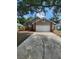 Two-story home featuring a two-car garage and well-maintained front yard at 2723 Talladega Dr, Orlando, FL 32826