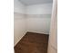 Walk-in closet with wooden floors and wire shelving, offering ample storage space at 2723 Talladega Dr, Orlando, FL 32826