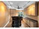 Stylish bar area featuring custom cabinets and sleek bar with seating for two at 2945 Lake Pineloch Blvd # 18-26, Orlando, FL 32806