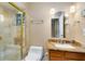 Bathroom featuring a marble sink, toilet, and tiled walk-in shower with glass door at 2945 Lake Pineloch Blvd # 18-26, Orlando, FL 32806