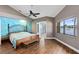 Inviting bedroom featuring wood floors and beautiful lake views at 2945 Lake Pineloch Blvd # 18-26, Orlando, FL 32806