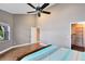 Bright bedroom with laminate floors, walk-in closet and neutral paint at 2945 Lake Pineloch Blvd # 18-26, Orlando, FL 32806