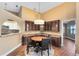 Dining area featuring built in wood cabinets, a round table and kitchen access at 2945 Lake Pineloch Blvd # 18-26, Orlando, FL 32806