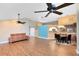 Bright and open living room features wood floors, ceiling fans, and great lighting at 2945 Lake Pineloch Blvd # 18-26, Orlando, FL 32806