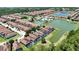 Aerial view of the neighborhood showcasing community amenities, pools, and ponds at 2985 Buccaneer Palm Rd, Kissimmee, FL 34747