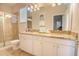 Bright bathroom with glass enclosed shower and double vanity sinks at 2985 Buccaneer Palm Rd, Kissimmee, FL 34747