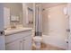 Bright bathroom with a shower/tub combo, neutral color scheme and ample counter space at 2985 Buccaneer Palm Rd, Kissimmee, FL 34747
