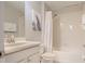 Bright bathroom featuring a shower/tub combo, vanity and neutral color scheme at 2985 Buccaneer Palm Rd, Kissimmee, FL 34747