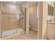 Modern bathroom with glass-enclosed shower and beige tile at 2985 Buccaneer Palm Rd, Kissimmee, FL 34747