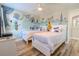 Bright bedroom featuring two beds, ceiling fan, and a mural wall at 2985 Buccaneer Palm Rd, Kissimmee, FL 34747