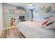 Charming bedroom featuring twin beds, fan and unique Mickey Mouse themed decor at 2985 Buccaneer Palm Rd, Kissimmee, FL 34747