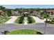 Gorgeous view of the community clubhouse, surrounded by meticulously landscaped grounds at 2985 Buccaneer Palm Rd, Kissimmee, FL 34747
