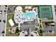 Aerial view showcasing a large community pool, clubhouse, tennis courts, and basketball court at 2985 Buccaneer Palm Rd, Kissimmee, FL 34747